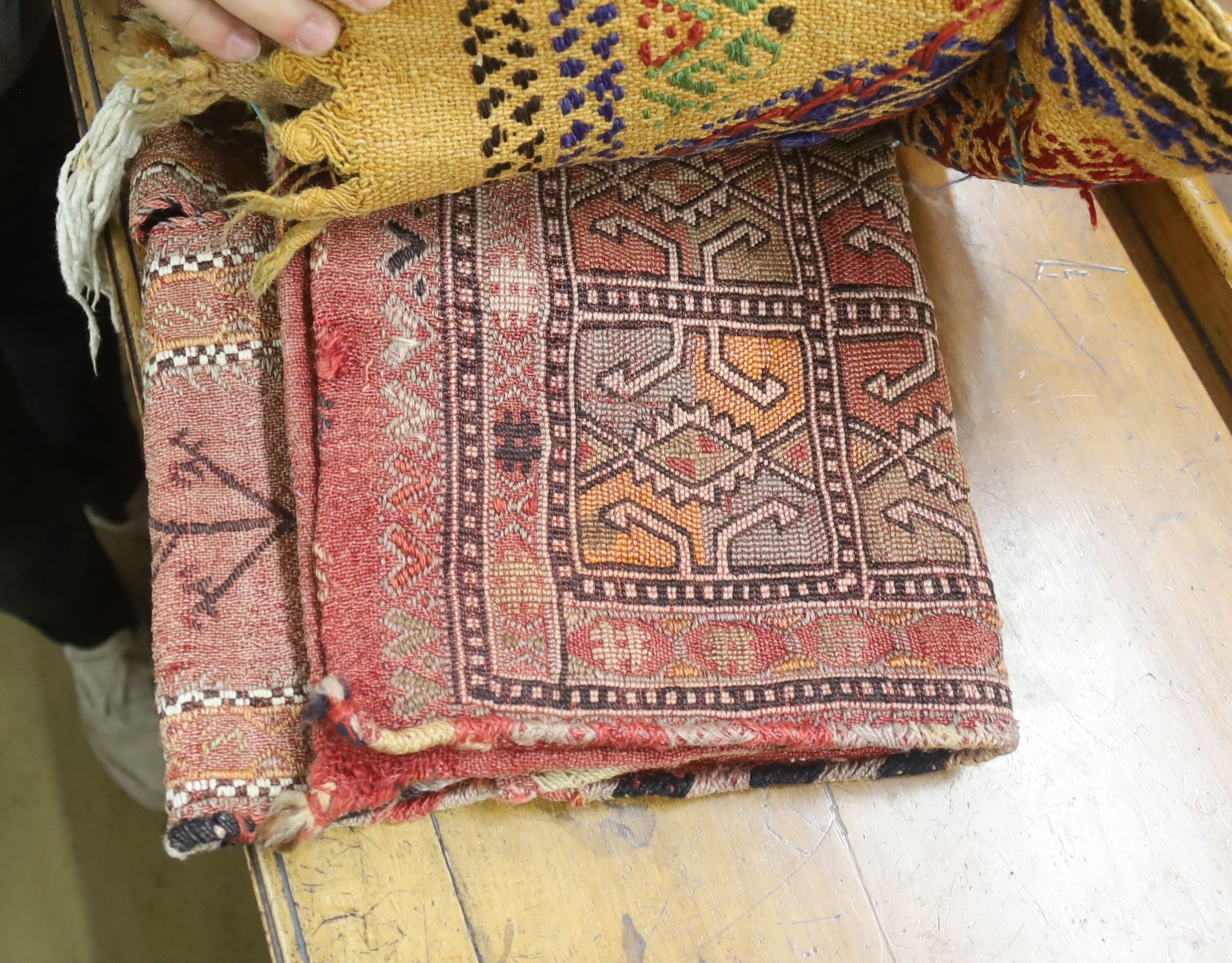 Seven Middle Eastern rugs/saddle bags